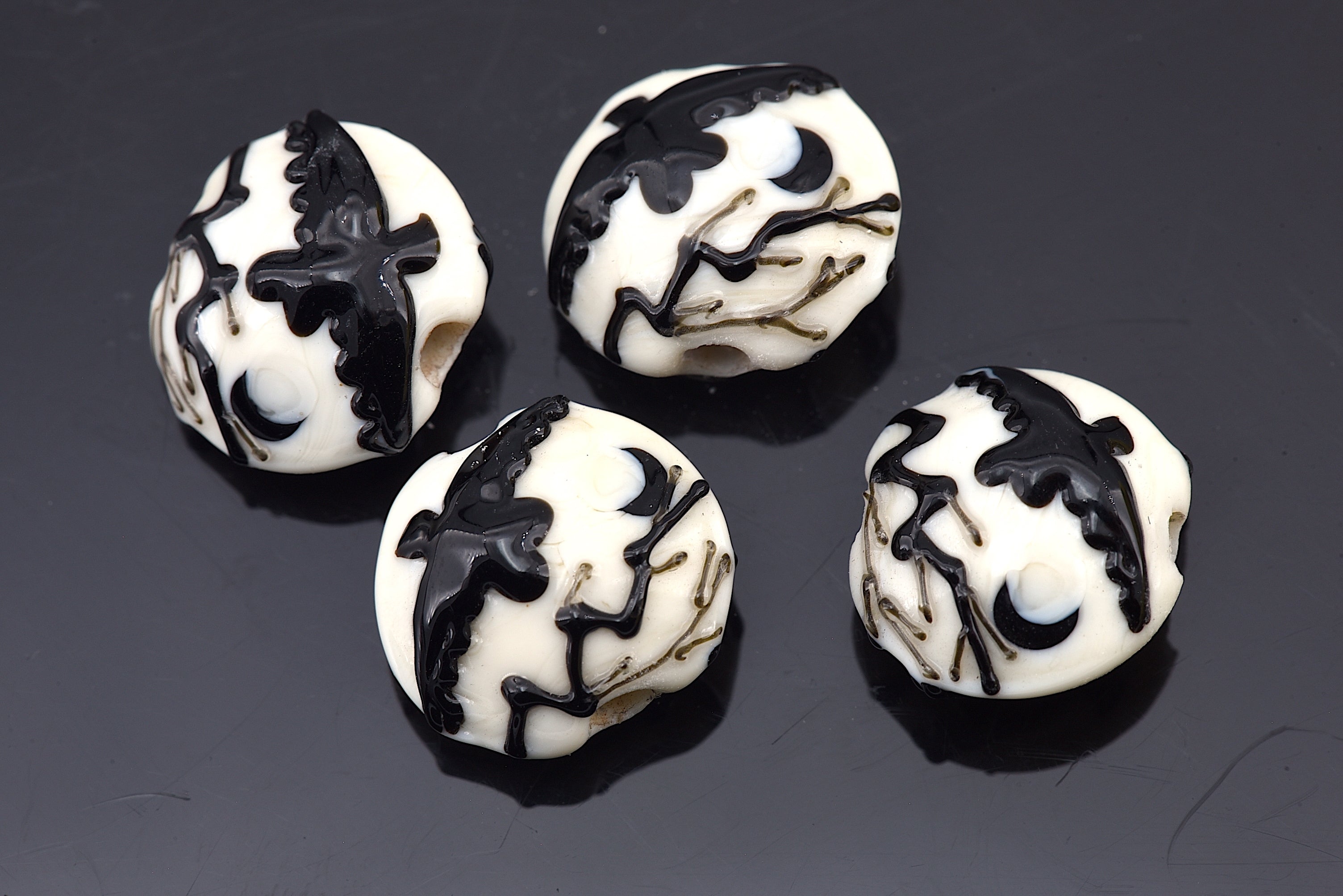 10306412 - Four Flying Raven Lentil Beads